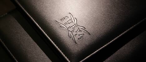A close-up of a textured surface with embossed text and a design.