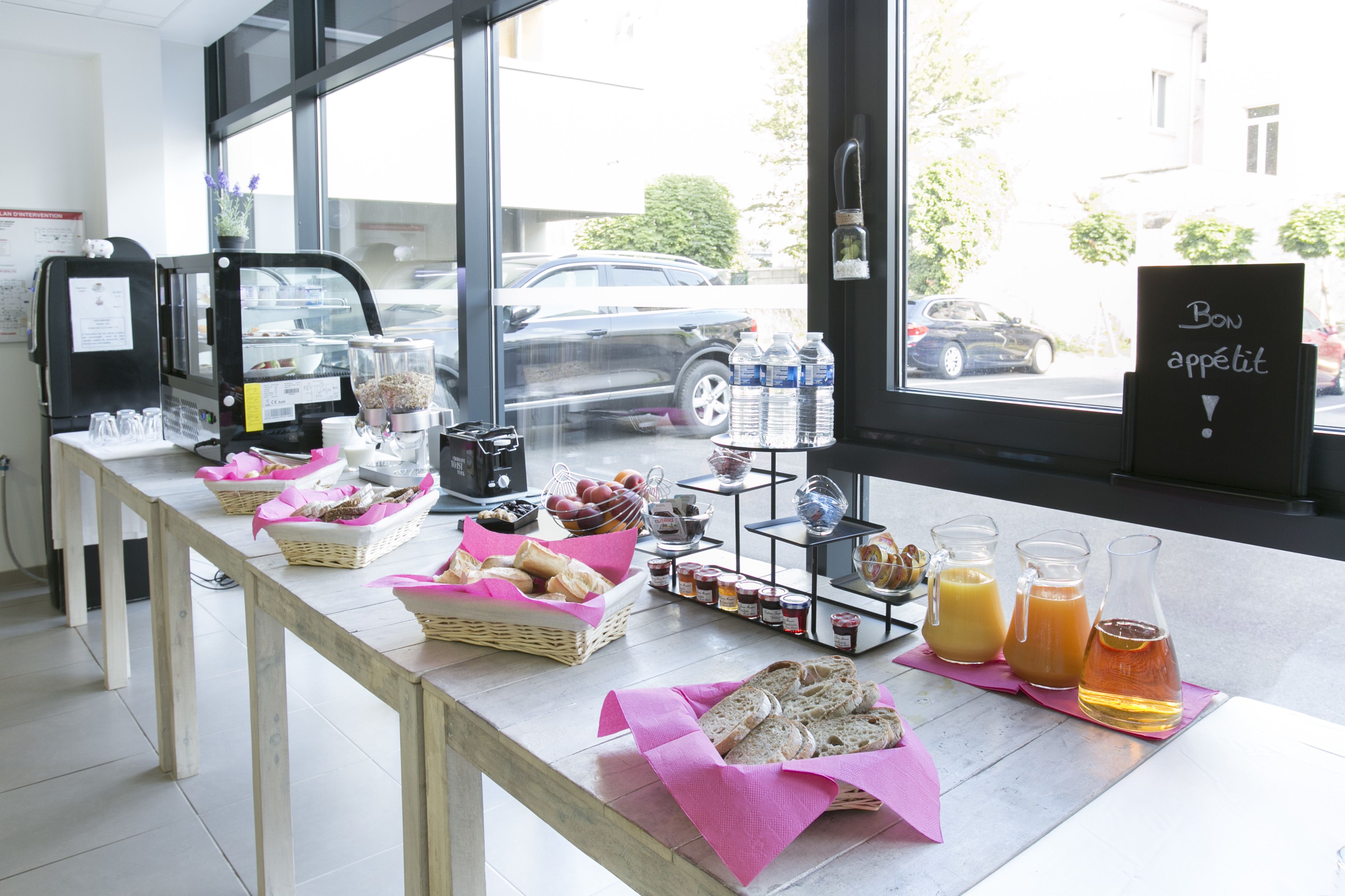 A breakfast buffet with various food items and beverages.