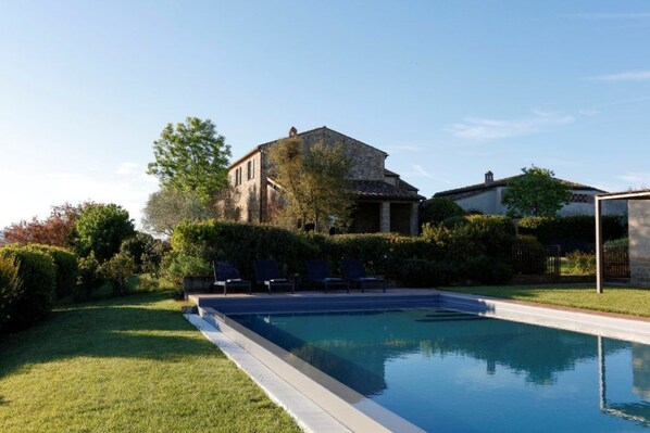 Seasonal outdoor pool, pool loungers