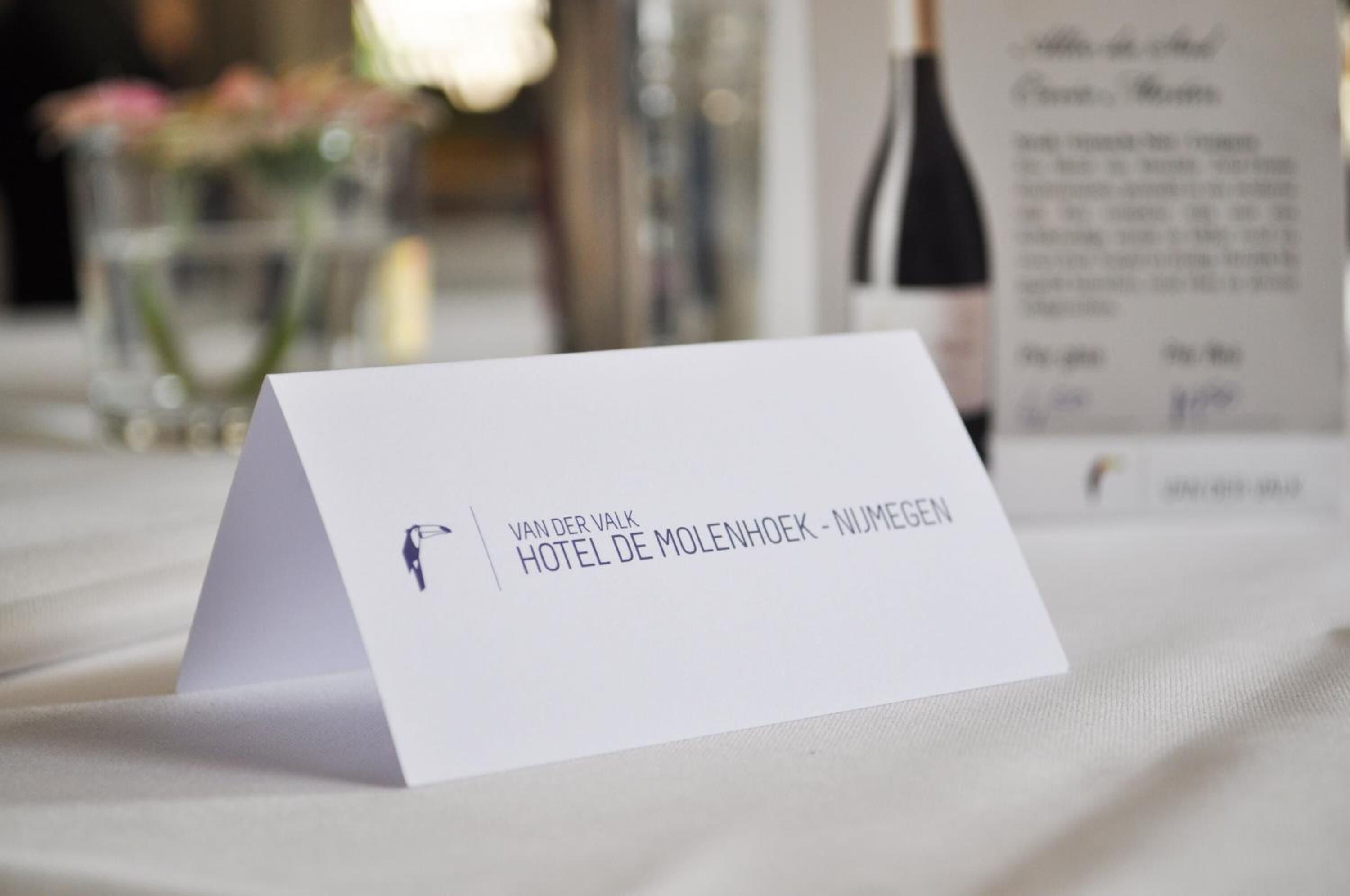 A white business card for Hotel De Molenhoek - Nijmegen.
