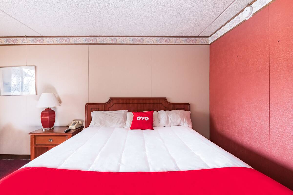 Desk, iron/ironing board, bed sheets