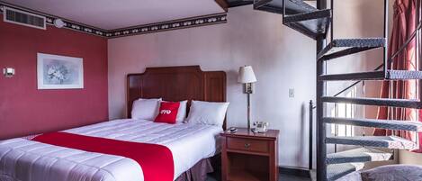 Desk, iron/ironing board, bed sheets