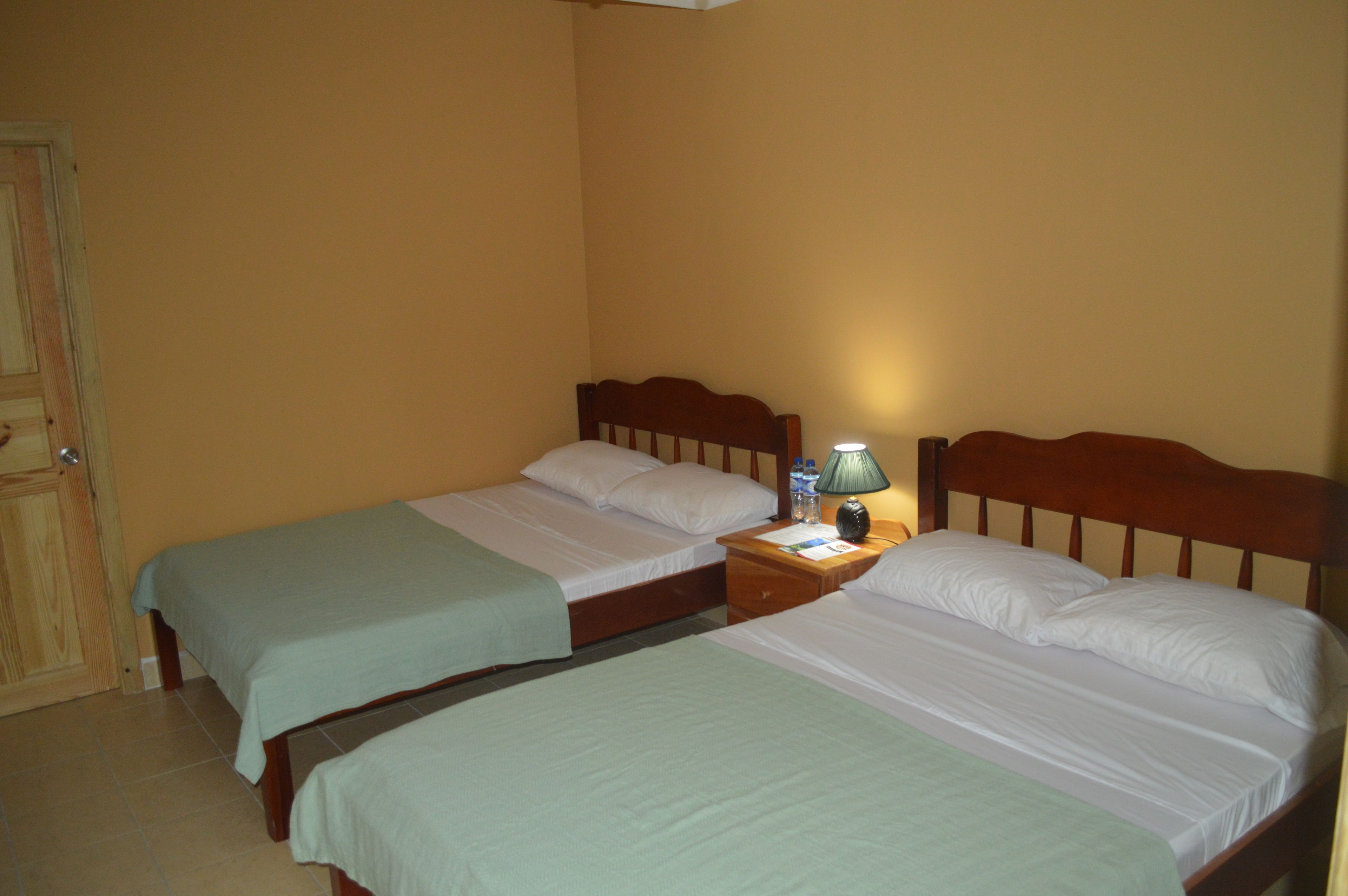 classic quadruple room, 2 double beds, lagoon view | 1 bedroom, blackout curtains, wifi, bed sheets