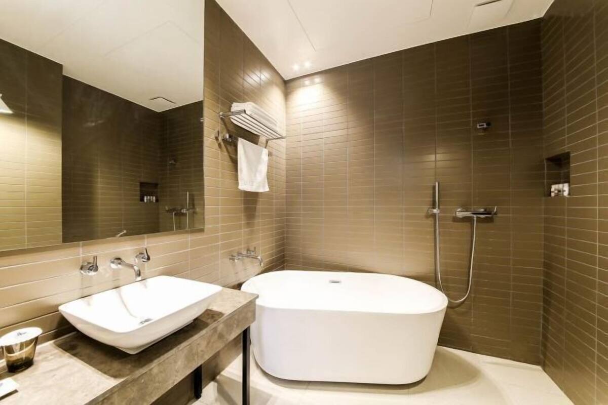 Bathroom | Separate bathtub and shower, deep-soaking bathtub, hair dryer, bathrobes