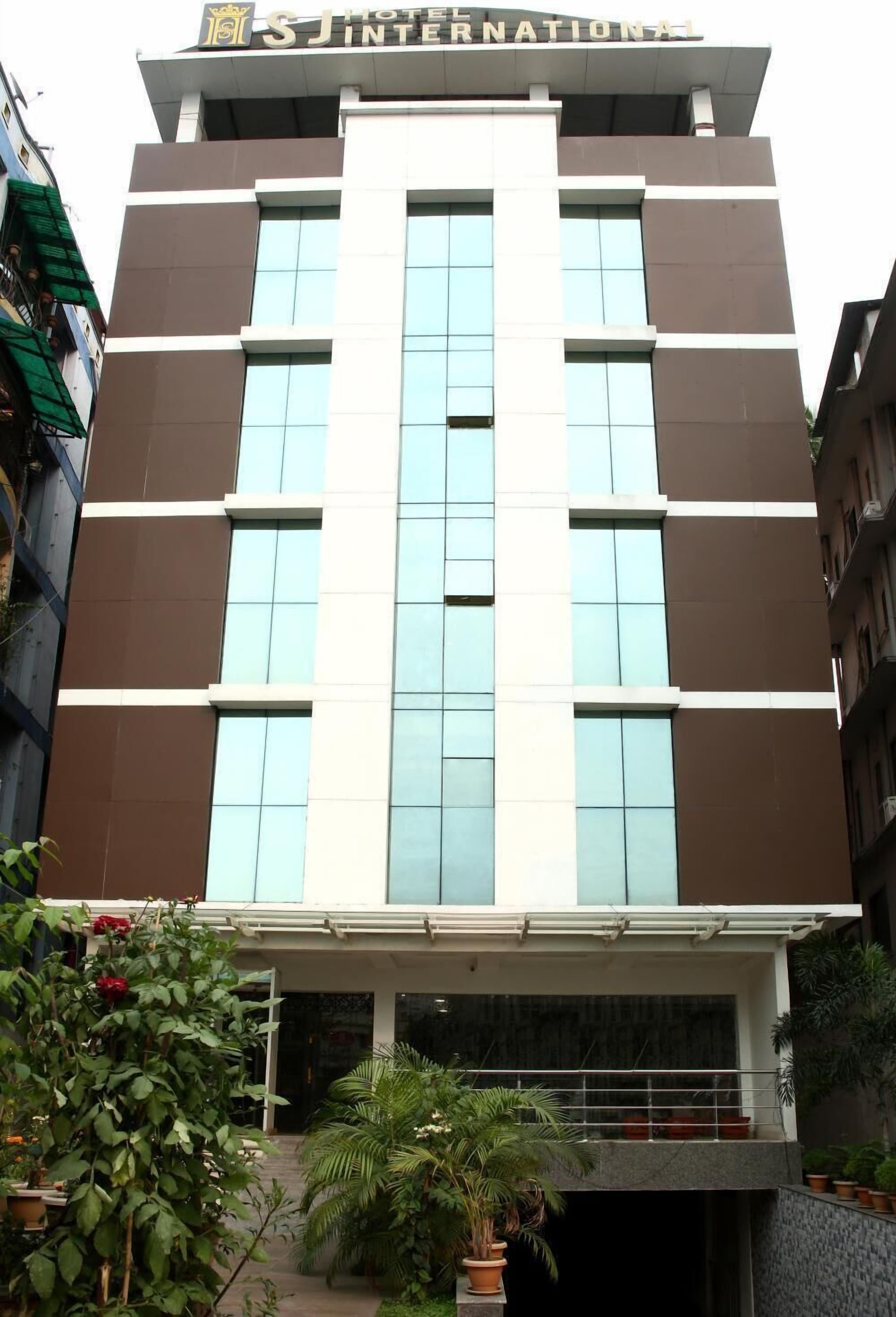 A modern hotel building with a prominent sign reading "Hotel International".