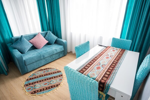 Family Apartment, 1 Bedroom, Refrigerator, City View | Living area
