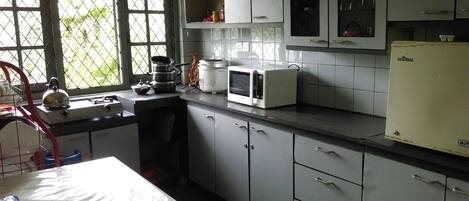 Fridge, microwave, stovetop, cookware/dishes/utensils