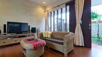 Family Villa, 4 Bedrooms | Living room | 32-cm LCD TV with satellite channels, TV