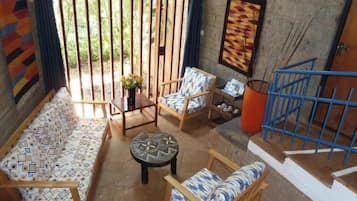 Deluxe Double Room, 1 Double Bed, River View, Ground Floor | Living area | TV