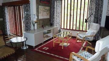 Deluxe Double Room, 1 Double Bed, River View, Ground Floor | Living area | TV