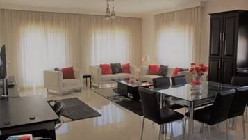 Family Apartment, 2 Bedrooms, Balcony | Living room | Plasma TV, Netflix