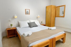 Individually decorated, desk, blackout drapes, iron/ironing board