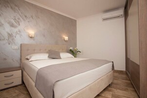 Superior Apartment, 1 Bedroom, Sea View | 1 bedroom, in-room safe, iron/ironing board, free cribs/infant beds