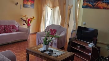 70-inch flat-screen TV with satellite channels, TV, DVD player