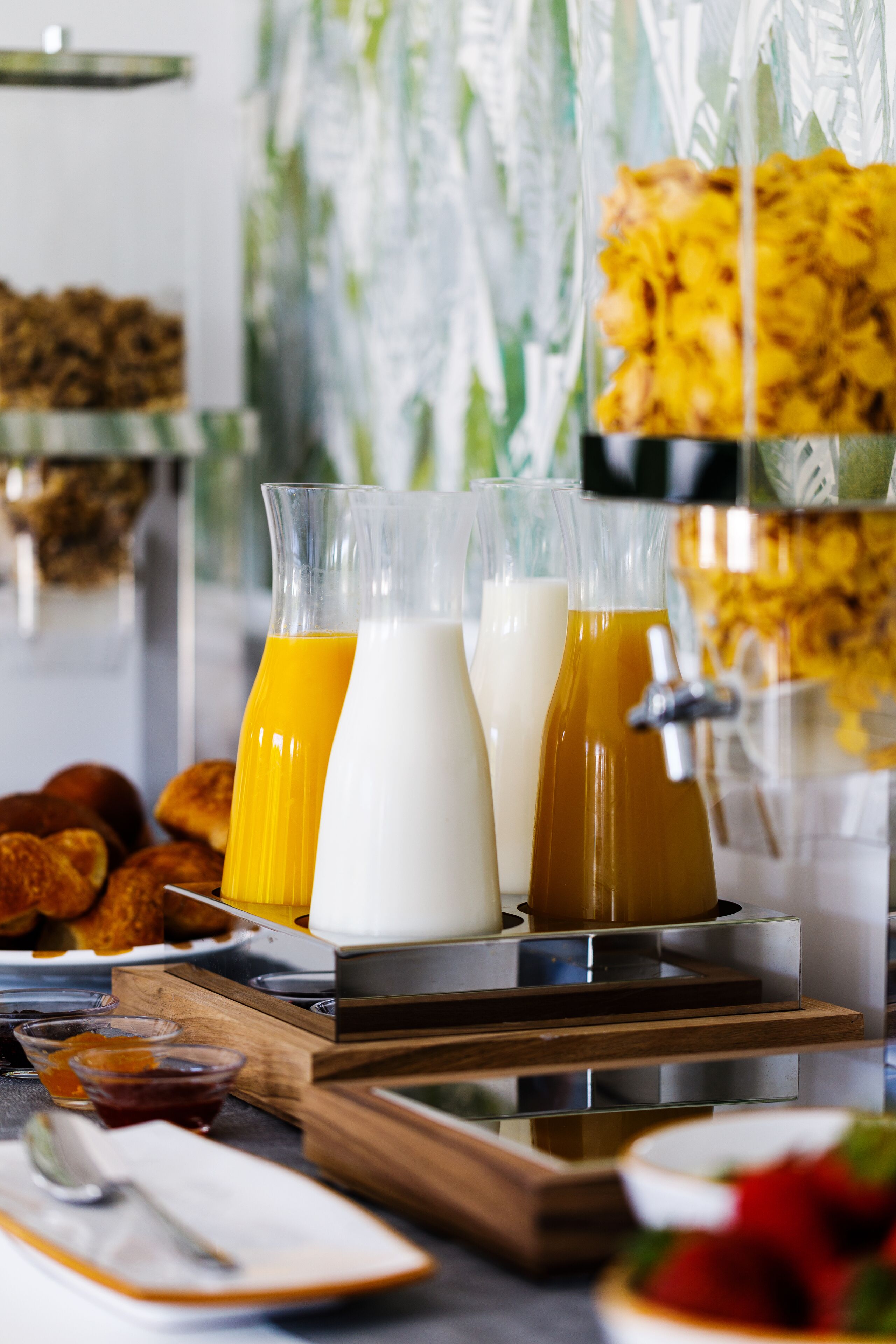 A breakfast buffet with various food items and beverages.