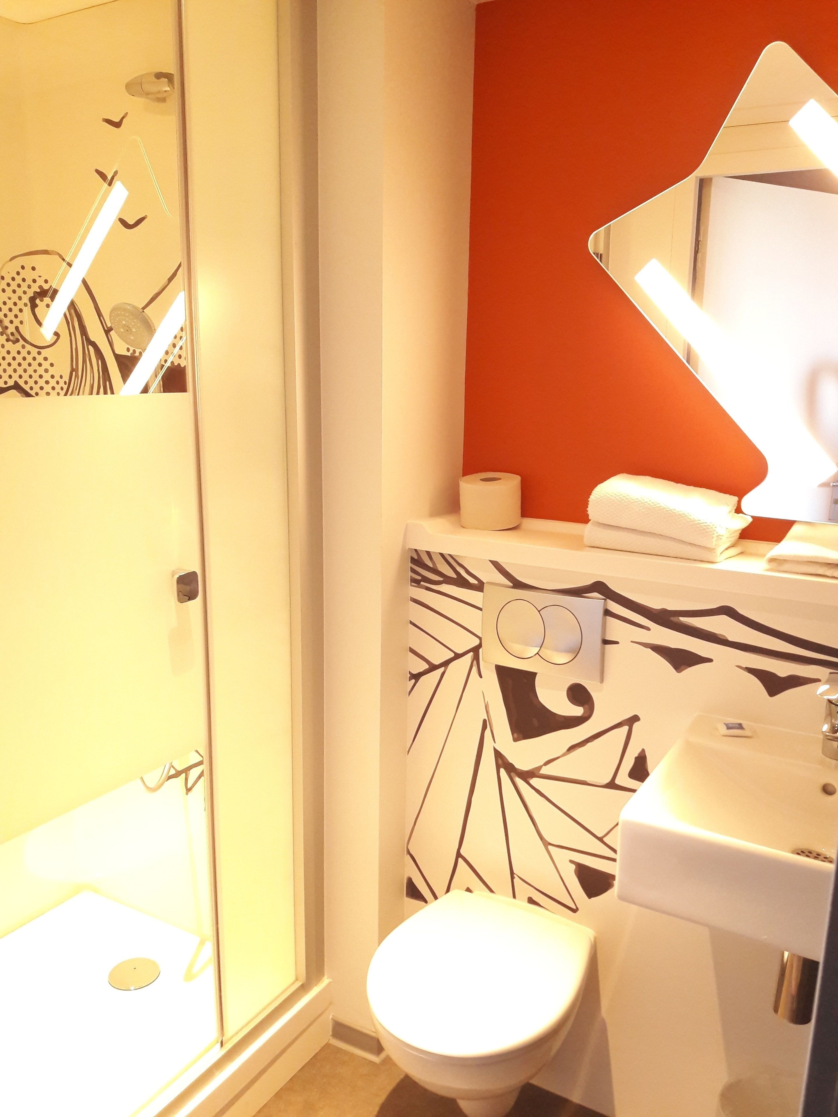 shower, rainfall showerhead, eco-friendly toiletries, towels