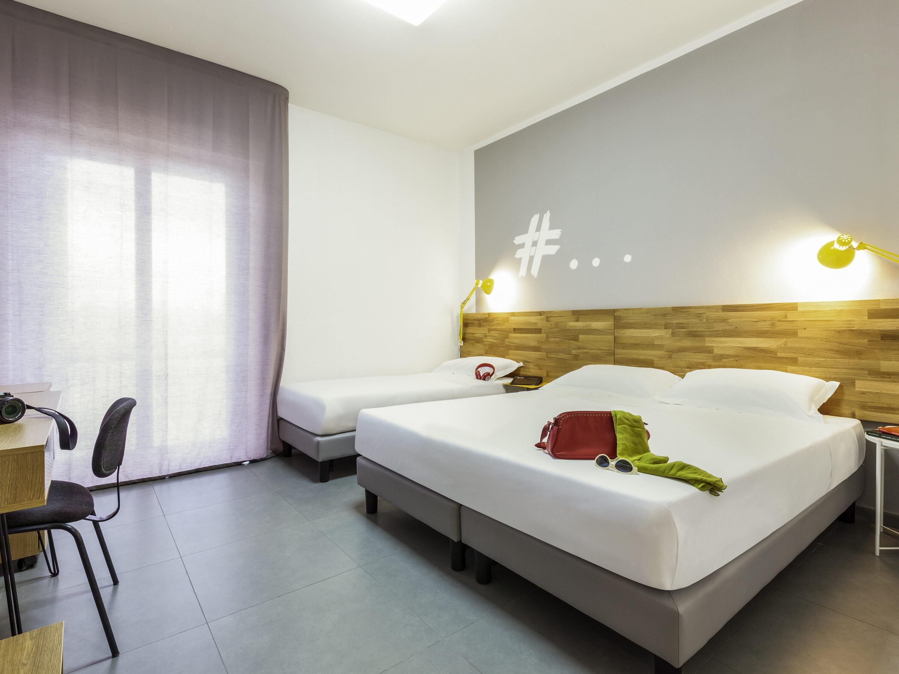 Premium bedding, desk, laptop workspace, soundproofing