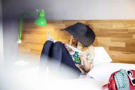 Premium bedding, desk, laptop workspace, soundproofing