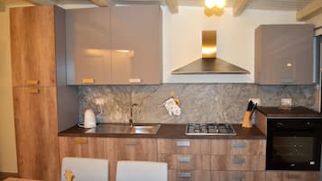 Luxury Apartment, 1 Bedroom | Private kitchen | Fridge, stovetop, espresso maker, coffee/tea maker