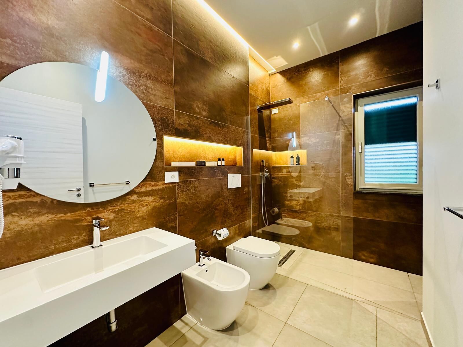 Shower, rainfall showerhead, designer toiletries, hair dryer