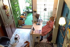 A room with a desk, chair, and a dog. - Nego Home (Bangkok)