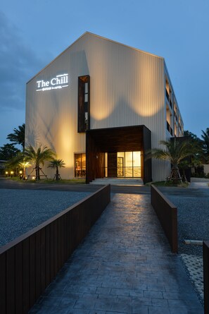 A modern building with a sign reading "The Chill" and a well-lit entrance. - The Chill at Krabi Hotel (Krabi)
