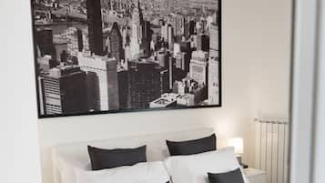 Premium bedding, desk, laptop workspace, soundproofing