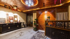 A traditional interior with wooden paneling, a decorative ceiling, and a tiled floor. - Hemu Shantang Street (Suzhou)