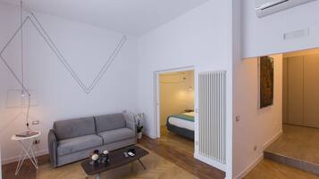 Luxury Suite, City View | Living area | 40-inch flat-screen TV with digital channels, TV