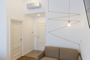 Dobbeltrom – exclusive, 1 queensize-seng med sovesofa | Oppholdsområde | En 40-tommers Flatskjerm-TV med digitale kanaler samt TV