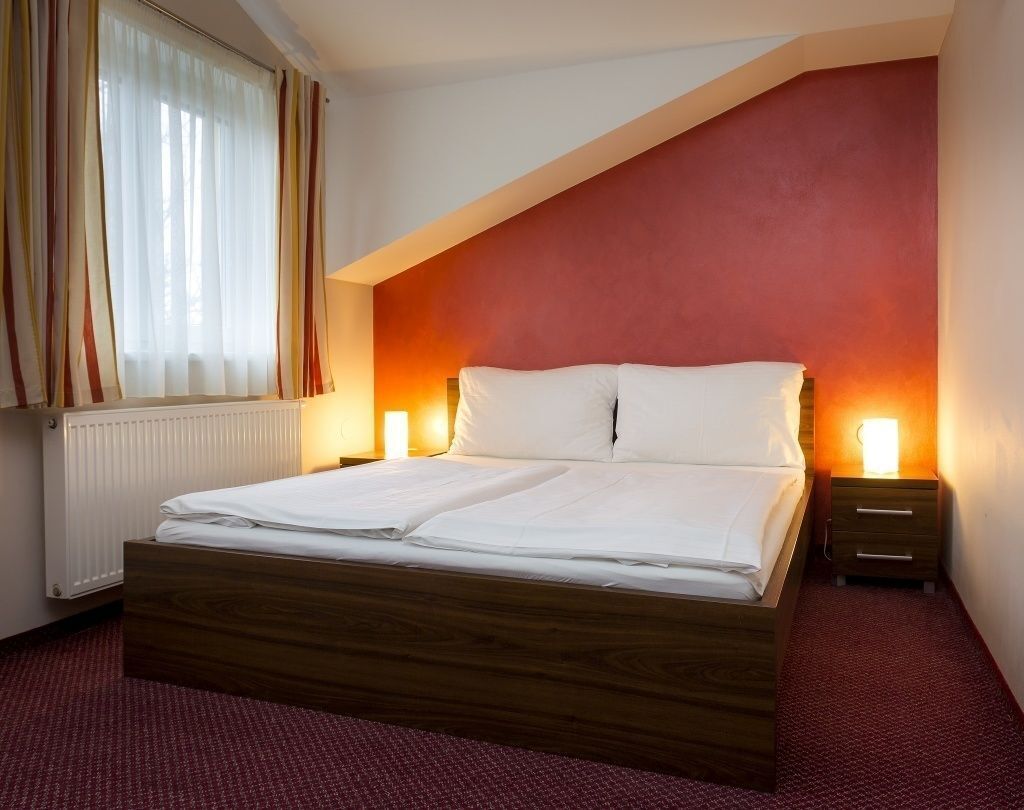 Desk, laptop workspace, blackout drapes, iron/ironing board