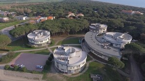 A large, circular building complex with multiple levels and a central courtyard.