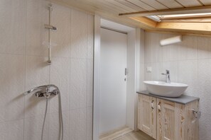 Apartment, 1 Bedroom | Bathroom | Shower, rainfall showerhead, designer toiletries, hair dryer