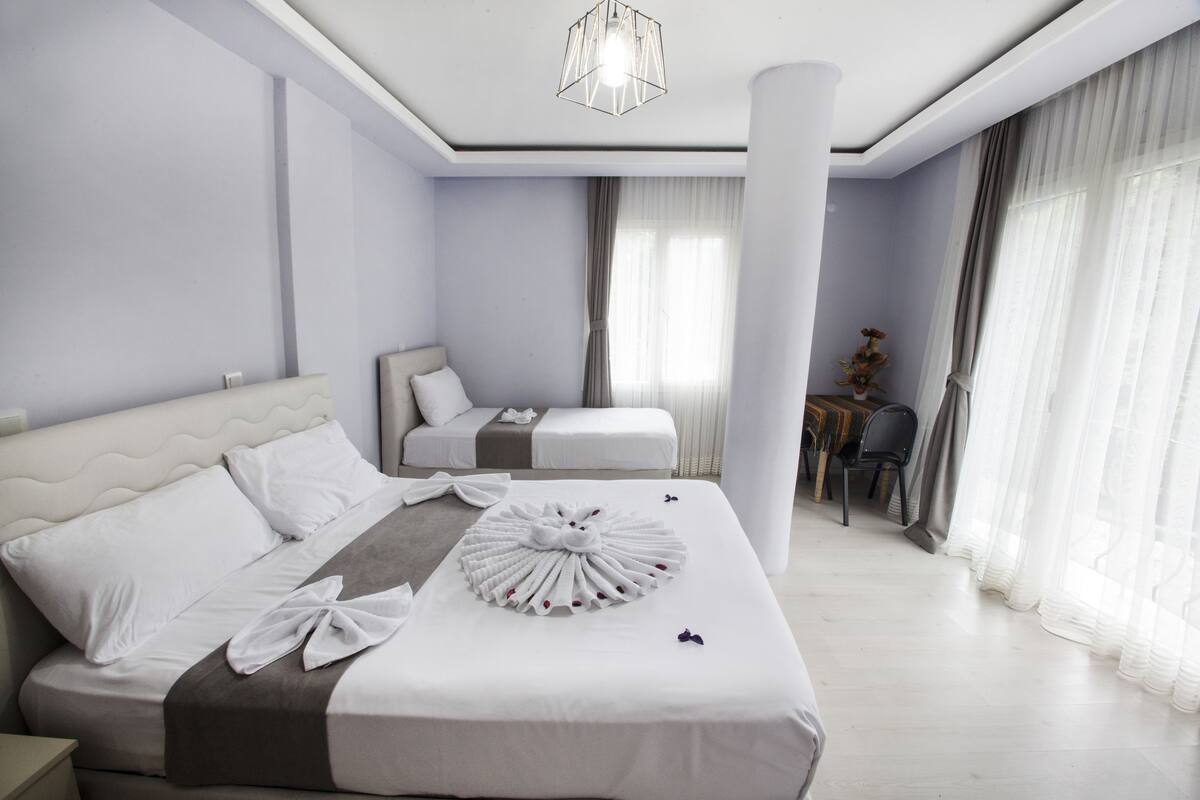 family triple room, mountain view | desk, blackout curtains, soundproofing, free wifi