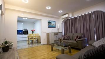 Apartment, 2 Bedrooms, Balcony, Sea View | Living area | Flat-screen TV