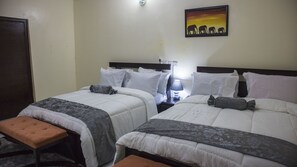 Habitación ejecutiva | Ropa de cama de alta calidad y caja de seguridad en la habitación 
