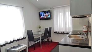 Appartamento Superior, 1 camera da letto | Area soggiorno | TV a schermo piatto