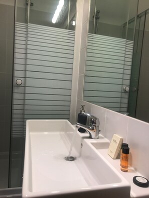 Shower, deep-soaking bathtub, free toiletries, hair dryer