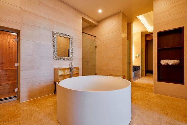 A modern bathroom with a large white bathtub, a wooden vanity, and a glass shower enclosure. - Four Points By Sheraton Liupanshui (Liupanshui)