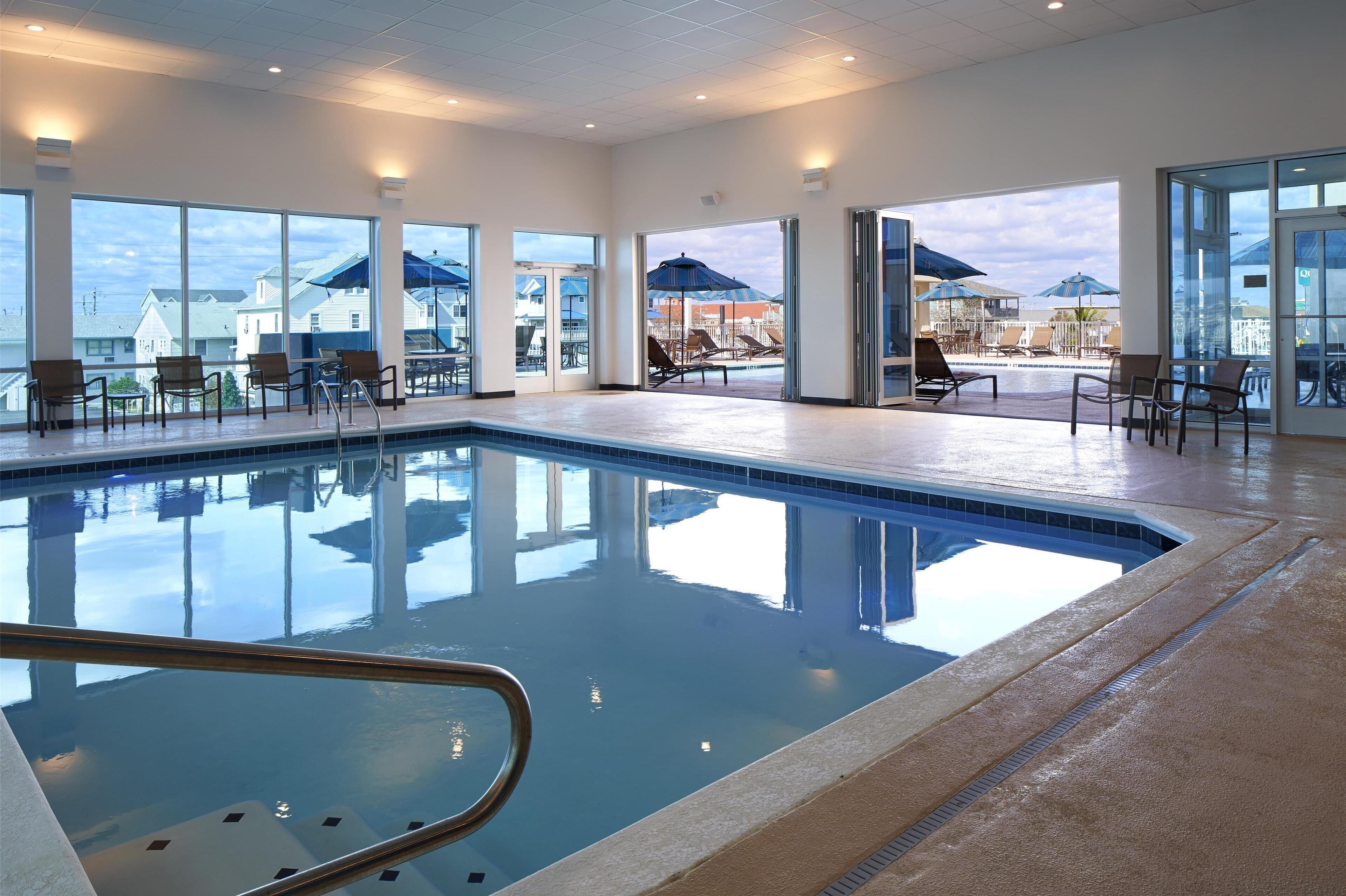 indoor pool, seasonal outdoor pool, pool umbrellas, pool loungers