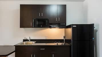 Full-size fridge, microwave, stovetop, coffee/tea maker