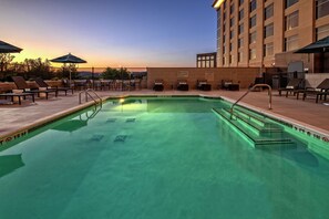 Seasonal outdoor pool, open 8:00 AM to 10:00 PM, pool umbrellas