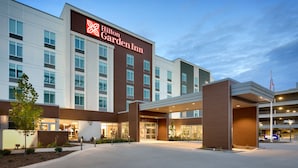 A Hilton Garden Inn with a modern facade, large windows, and a well-lit entrance area. - Hilton Garden Inn Boise Downtown (Boise)