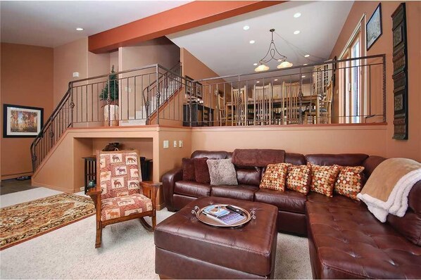 House, Multiple Beds (Iron Oak Duplex I) | Living room | TV, fireplace, table football