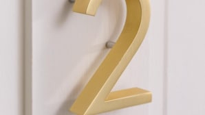 A door with a gold-colored number '2' sign. - The Deers Head Inn (Elizabethtown)