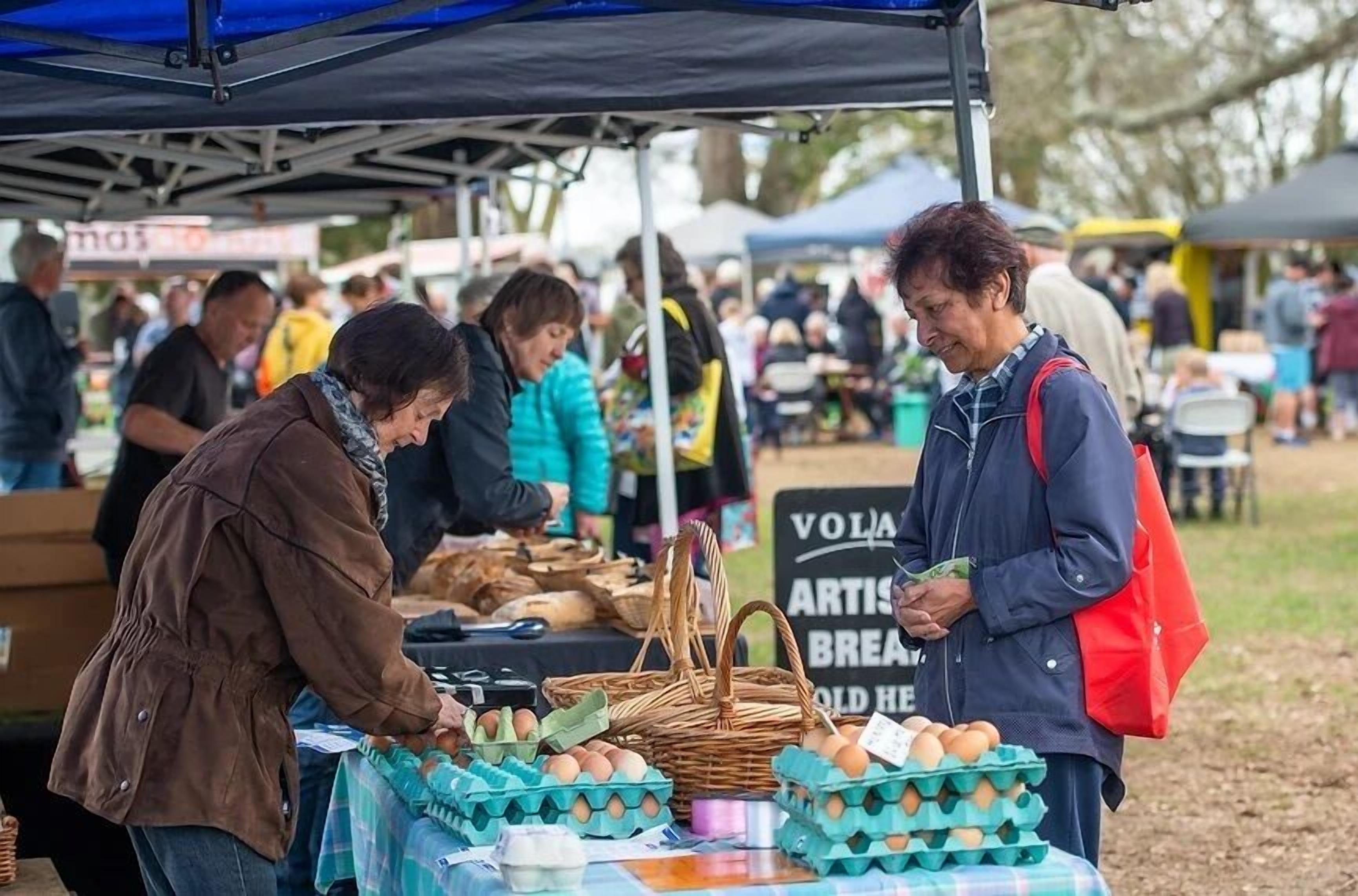 A market stall with eggs and baskets.