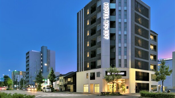 A multi-story hotel with a prominent 'HOTEL M'ST' sign, featuring a modern architectural design with large windows and a flat roof. - HOTEL M’s EST KYOTO STATION SOUTH (Kyoto)