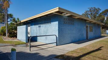 A small, single-story building with a blue exterior and a flat roof.