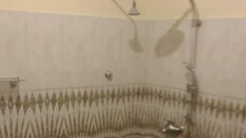 Deluxe Room | Bathroom | Shower, jetted tub, rainfall showerhead, towels