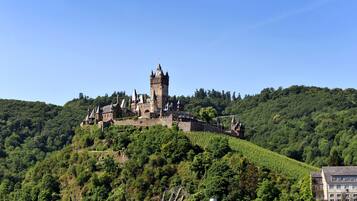 A castle on a hill with a clear sky.